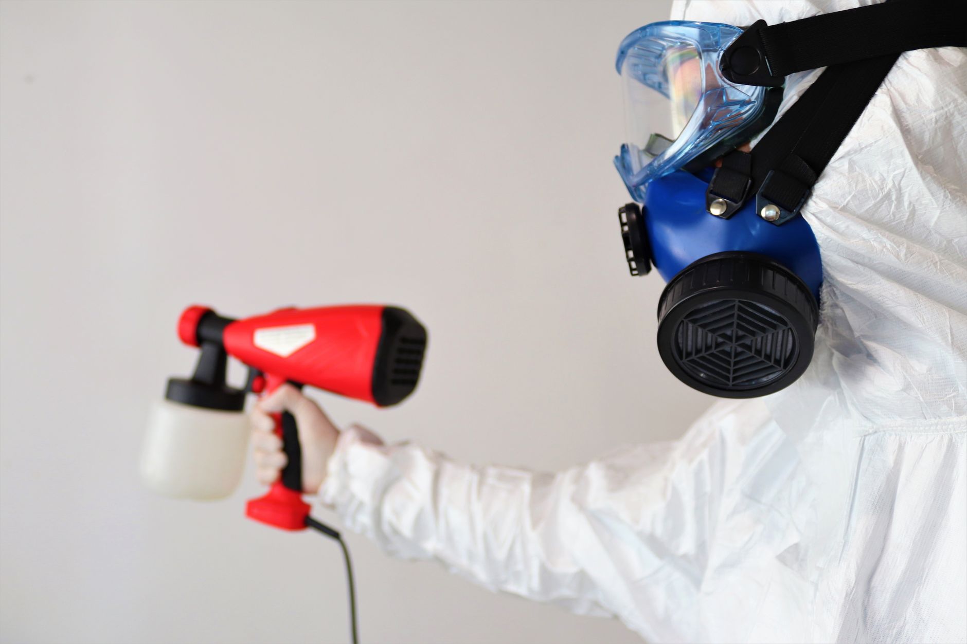 A professional mold remediation technician conducting a moisture inspection with specialized equipment in a Pflugerville home.